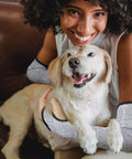 Person with dog wearing cut resistant arm sleeves for work and gardening, protective arm protectors for men with thumb hole.
