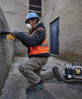 Worker using 60V Max Brushless Cordless Grinder With Kickback Brake Four And A Half Inch To Six Inch Wheel 9,000 RPM for brick grinding