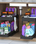 Heavy Duty Black Under Sink Organizer 2 Pack with smooth glide sliding drawers storing cleaning supplies under bathroom sink.
