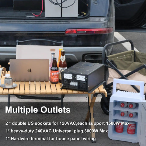 3000W Split Phase True Sine Wave Inverter with four outlets on a wooden table beside drinks and a laptop.