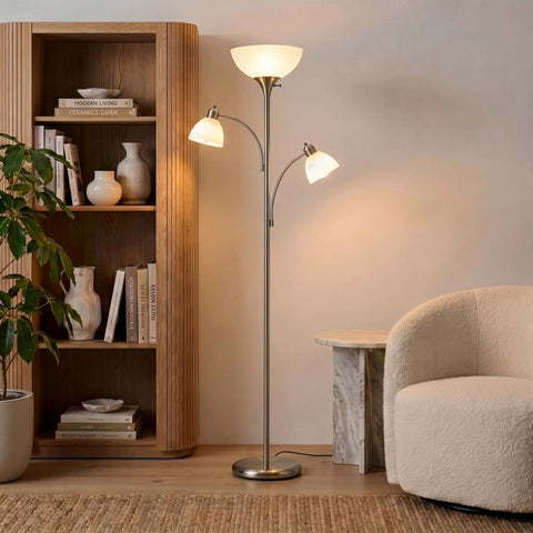 Double LED Floor Lamp With Two Reading Lights Dimmable Torchiere Tall Silver Standing Lamp For Living Room Office And Bedroom Reading Ultra Bright Three Bulb Warm White 3000K next to a bookcase and chair