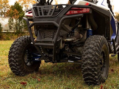 Rear view of Arched Boxed Radius Rods for Polaris RZR Pro XP and Pro XP 4 Off Road Upgrade With High Ground Clearance Beefy Rugged Steel Build Powder Coated Black Finish Easy Install And Durable Performance on a UTV.
