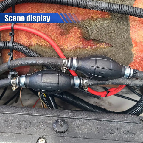 Heavy Duty 8mm Manual Primer Bulb Fuel Transfer Pump Works Like A Champ For Gas And Diesel Handles Kerosene Or Water Pulls Clean Each Time Zero Sweat Fits Cars Boats Motorcycles installed in engine compartment showing black hoses and fittings.