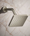 Parallel Single Function Showerhead With 1.75 GPM Flow, Katalyst Spray, MasterClean, Vibrant Brushed Nickel, mounted on marble