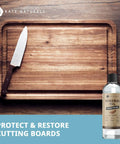 Top Shelf Food Grade Mineral Oil Eight Ounce Wood Conditioner near a wooden cutting board with a knife.