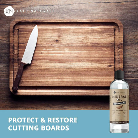 Top Shelf Food Grade Mineral Oil Eight Ounce Wood Conditioner near a wooden cutting board with a knife.