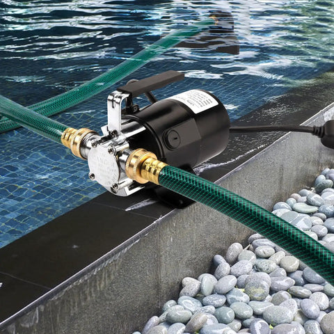 Hella Efficient Heavy Duty Electric Water Transfer Pump 115V 1/10 Hp with suction hose by poolside for quick draining.