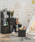Six Cube Storage Organizer With Three Extra Drawers in kids' room, black cubes filled with toys and books, next to play tent
