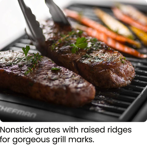 Steaks and vegetables cooking on Smokeless Indoor Grill With Nonstick Cooking Surface And Adjustable Temperature From Warm To Sear For Realistic At Home BBQ Flavor Easy Cleanup With Dishwasher Safe Water Tray Black