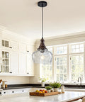 Vintage Glass Pendant Light Kitchen Island with Walnut Wood 9.8in hanging above a white kitchen island countertop with fruits.