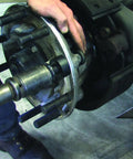 Installation of 22mm truck wheel stud using Truck Wheel Stud Installer Tool For 22mm Studs, Use With Impact Wrench Or Ratchet, Thrust Bearing Assist Pulls New Wheel Stud Into Place, Heavy Duty Vehicle Service Accessory For Quick, Reliable Wheel Maintenance.