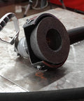 Tiger ZIRC Type 11 Flaring Cup Wheel ZA16-Q 4/3 in x 2 in x 5/8-11 attached to grinder, zirconia grains visible