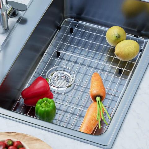 Heavy Duty Stainless Steel Kitchen Sink Grid Protector With Rear Drain Layout And Secure Hole Plug Fits Single Bowl Basins, featuring vegetables in sink.