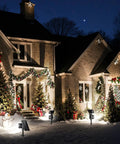 4 Pack Solar Spotlight Lights Outdoor Waterproof Landscape Lighting illuminating house with Christmas decor at night