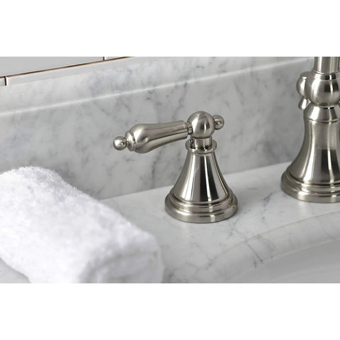 Brushed nickel metal lever handle of Governor Widespread Lavatory Faucet With Brass Pop Up And Metal Lever Handle In Brushed Nickel 8 Inch Spread Quarter Turn Ceramic Cartridge Drip Free Water Saver 1.2 GPM At 60 PSI California Title 20 Compliant Includes Mounting Hardware on marble countertop close-up.
