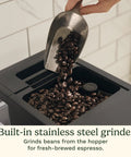 Espresso Bar Fully Automatic Espresso Machine With Built In Grinder And Steam Wand For Cafe Quality Lattes Cappuccinos Americanos And Cold Extracted Espresso At Home showing coffee beans being poured into stainless steel grinder.