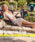 Person relaxing in oversized hammock camping chair with footrest, swing rocker design, adjustable angles, cup holder, side pocket