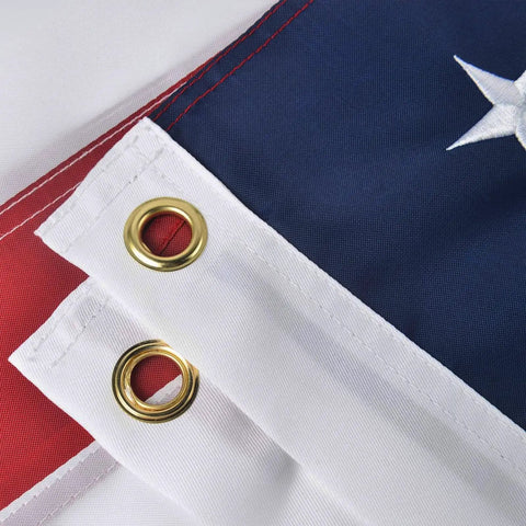 Close-up of Patriotic 2x3 Ft USA Flag Crafted From Oxford Polyester with brass grommets, vivid colors, sewn stripes, embroidered stars.