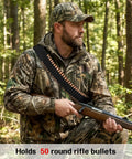 Hunter in forest wearing Adjustable 50 Round Rifle Shell Holder Sling For Rifles - Durable Nylon Two Point Gun Belt