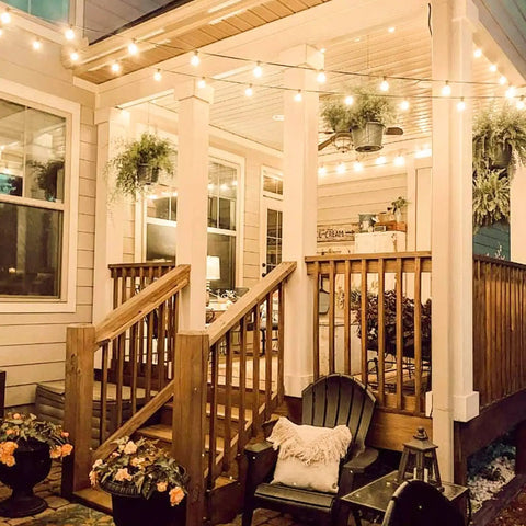 50Ft Outdoor String Lights With 48 Dimmable G40 LED Bulbs Shatterproof UL Listed Waterproof Globe Lights illuminating a patio.