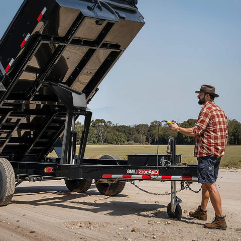 Worker operating Heavy Duty Hydraulic Dump Lift Kit for Trailers and Trucks, 22,000 Lb Capacity, showing raised scissor hoist system.