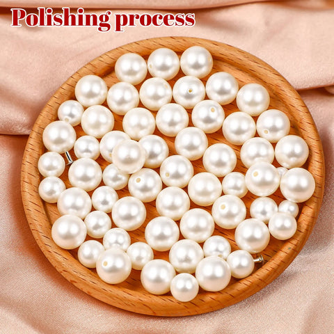Front view: white faux pearl beads in a round wooden dish for DIY clothing accessories (150 pcs)