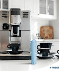 Sweet Sip Water Filter Cartridges For Coffee Machines, Six Pack Refills on counter next to Jura coffee machine and cups.