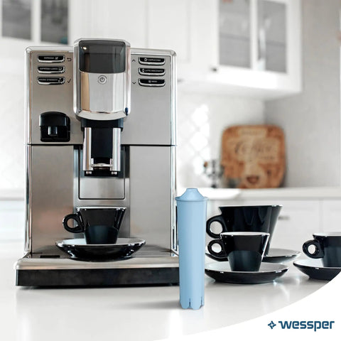 Sweet Sip Water Filter Cartridges For Coffee Machines, Six Pack Refills on counter next to Jura coffee machine and cups.