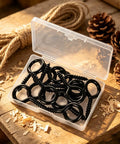 10 Pack Tough As Nails M6 Eye Screws 2.2 Inch Black Heavy Duty Carbon Steel Self Tapping Screw Eye Hooks in case on wood surface.