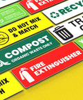 High Visibility Fire Extinguisher Sticker Set for Office and Commercial Spaces No Brainer Safety Sign laid out on yellow surface