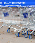 Five Inch Shopping Cart Wheel Set With Dual Precision Bearings And Polyurethane Tread Blue Crown installed on carts on pavement.