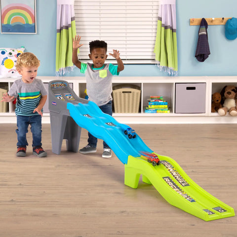 Kids playing with Ultra Durable Dual Track Downhill Raceway With Over 6 Feet Of Indestructible Track For Toddlers And Kids indoors