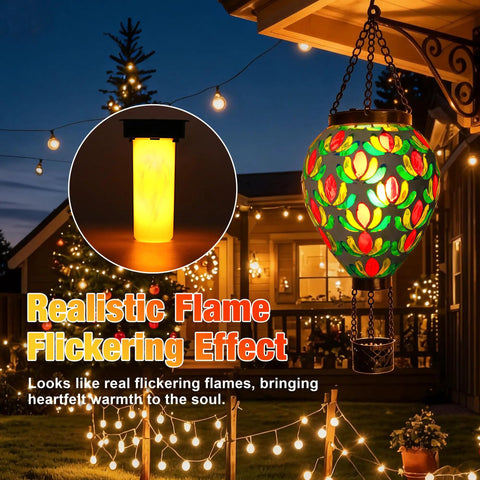 Mosaic Glass Hot Air Balloon Solar Lantern With Flickering Flame Effect And Dreamy Blue Green Purple Projections For Garden Patio Yard Outdoor Decor That Creates A Chill Nighttime Vibe hanging in garden at night.
