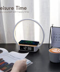 Bedside Lamp With Alarm Clock And Wireless Charger, Sunrise Wake Up Light on desk with coffee, emphasizing leisure time