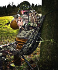 Camouflage Hammock Style Camping Chair That Hangs From Trees No Fuss Setup In Seconds Lightweight Portable Hunting Gear For Outdoorsy Hunters And Camp Lovers Supports Up To 330 Pounds used by camouflaged hunter