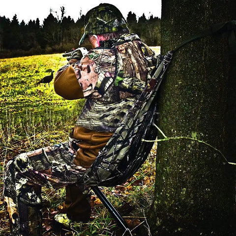 Camouflage Hammock Style Camping Chair That Hangs From Trees No Fuss Setup In Seconds Lightweight Portable Hunting Gear For Outdoorsy Hunters And Camp Lovers Supports Up To 330 Pounds used by camouflaged hunter