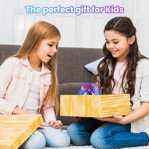 Two children excitedly open a gift box revealing a 3D Printed Gear Sphere Fidget Toy For Sensory Stress Relief And Chill, deep purple, 2.6 inches.