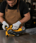 Badass Cordless Brushless Belt Sander With Six Variable Speed Settings and Raw Grip in use on metal surface by a worker.