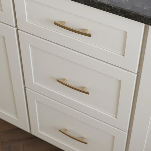 Champagne Bronze Cabinet Handles 3 Inch Center To Center Classic Pulls installed on white kitchen cabinets showing elegant design