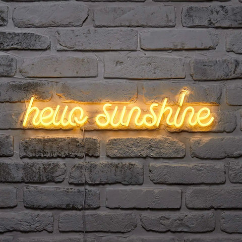 Lit Hello Sunshine Neon Yellow LED Sign Wall Light With 24 Inch Neon Flex Featuring 229 Yellow LEDs on brick wall