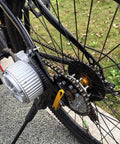 Close-up of bike wheel featuring Bike Spoke Chain Wheel And Rear Sprocket Kit 32T With 16T Freewheel Adapter For Left Drive Motor MY1016Z.
