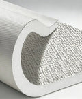 Nine Millimeter IXPE Foam Wall Panels Peel And Stick For Interior Basement Finishing Self Adhesive Thermal Shield showing grey textured surface.