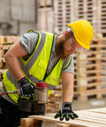 Worker wearing heavy duty work gloves for men with ANSI Cut Level A5 protection in construction site