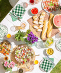50 Pcs Camp Bachelorette Party Cocktail Napkins 3 Ply Disposable Paper Napkins Beige And Green Plaid Checkered Design For Wedding Bridal Shower Table Decor Beverages And Party Supplies on a picnic table with food and drinks.