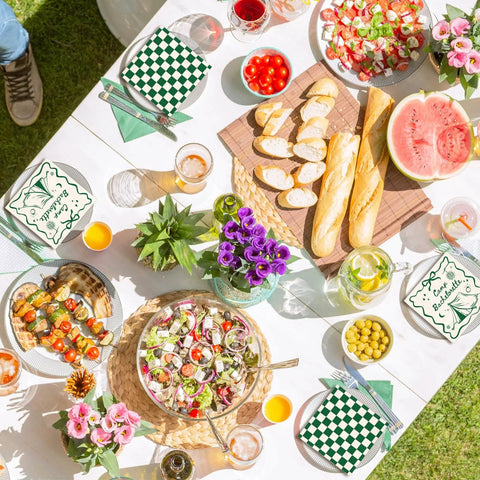 50 Pcs Camp Bachelorette Party Cocktail Napkins 3 Ply Disposable Paper Napkins Beige And Green Plaid Checkered Design For Wedding Bridal Shower Table Decor Beverages And Party Supplies on a picnic table with food and drinks.