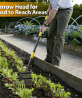 Person using heavy duty garden leaf rake with 9 inch narrow head and 65 inch adjustable handle in a vegetable garden