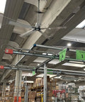 Heavy Duty 12ft HVLS Ceiling Fan With Brushless Motor And Built In VFD For Industrial And Commercial Use, mounted in a warehouse.