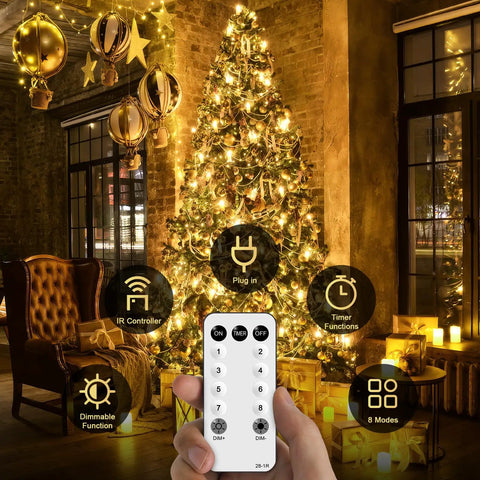 168Ft Outdoor LED String Lights With 600 Warm White LEDs on a Christmas tree in cozy room, remote in hand