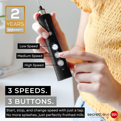 Person holding a handheld USB C rechargeable milk frother with 3 speed settings and stainless steel double whisk, black mini electric stirrer