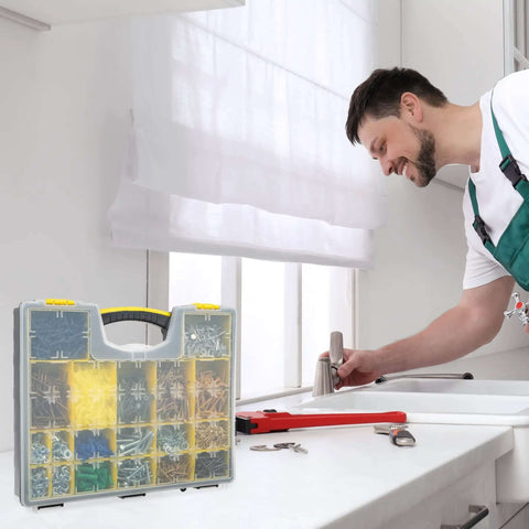 Man using sink with Set Of Four Plastic Clear Top Tool And Parts Organizer Box Set for Grab And Go Garage visible on counter
